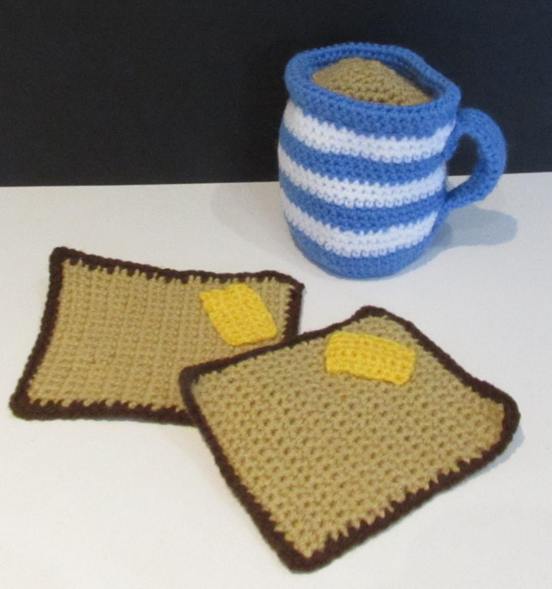 knit mug with hot chocolate and two pieces of knit toast with butter