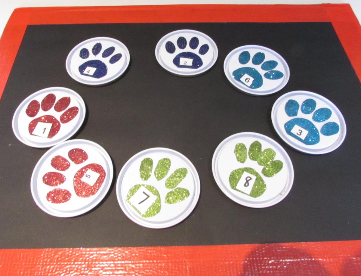 cards with different color paw markets on them, each labeled with a number