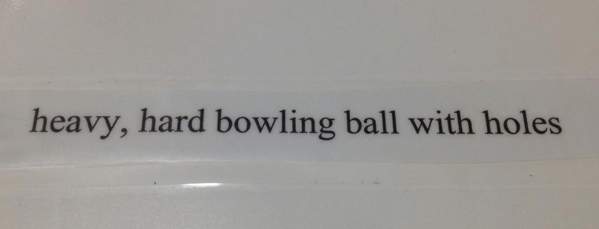 Heavy, hard bowling ball with holes