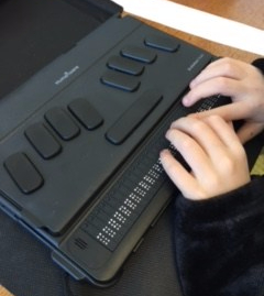 D. checks to see what she has written. D writes her story