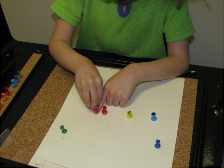 Using pushpins to mark braille