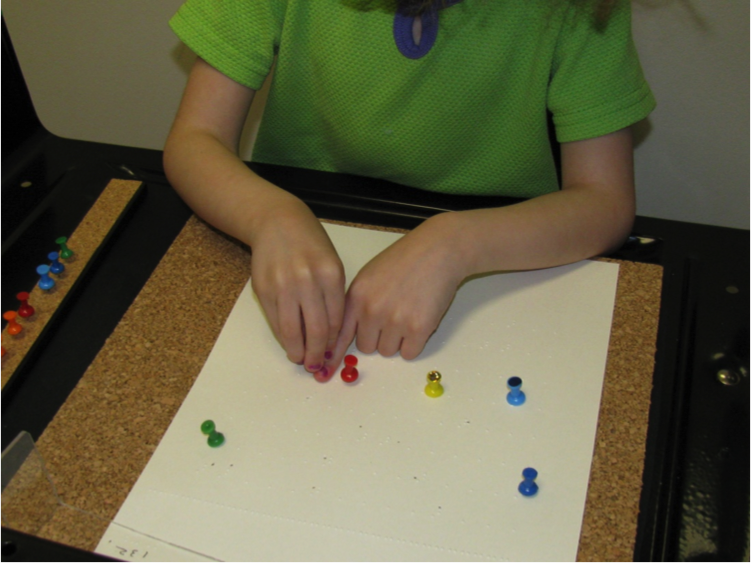 Using pushpins to mark braille Using pushpins to mark braille