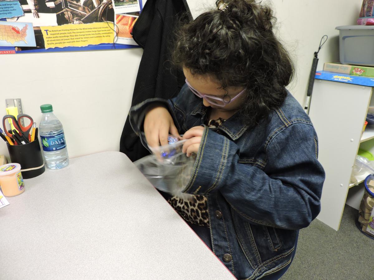 Placing candy in the bag