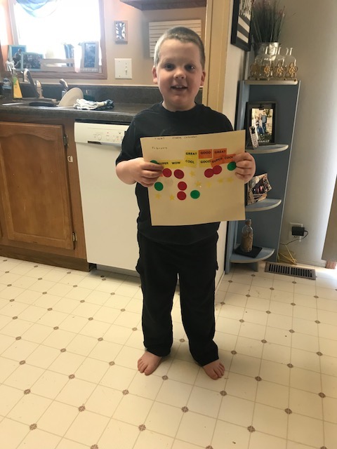 Liam holding his reading log