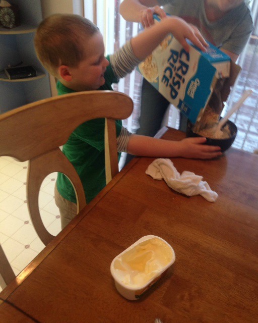 liam pouring cereal in bowl