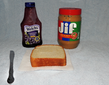 peanut butter jelly toast and a knife