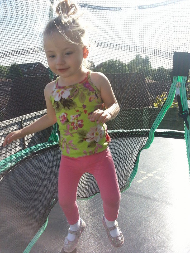 Young girl on trampoline