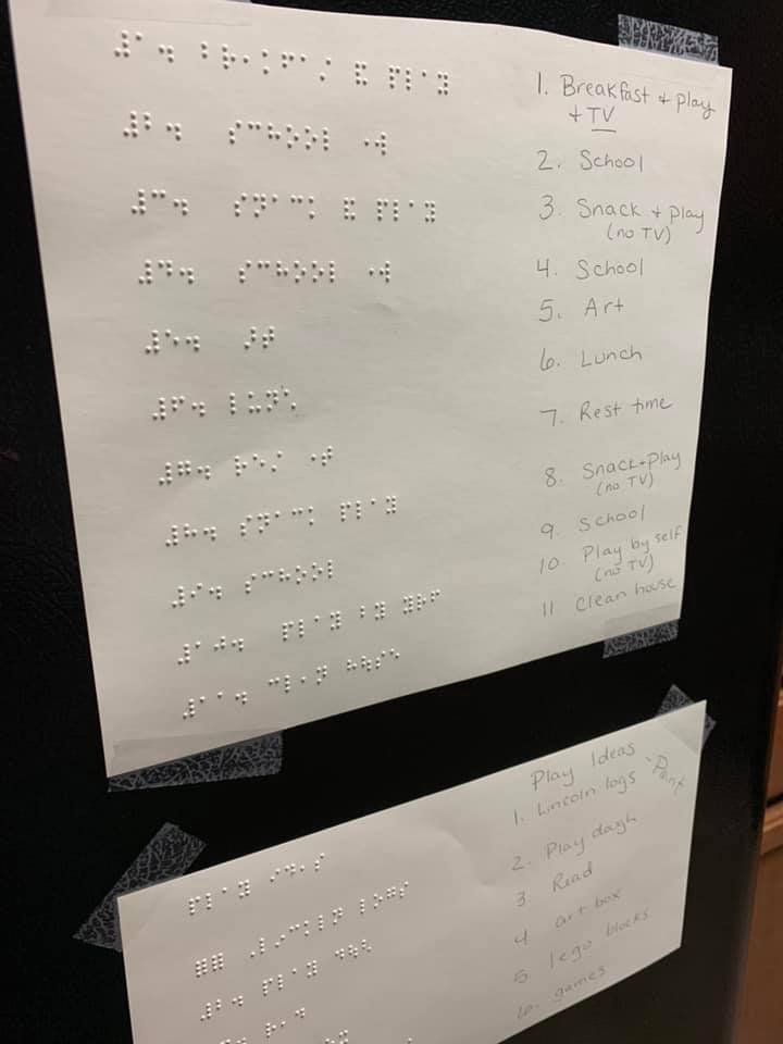Daily schedule in print and braille posted on the fridge