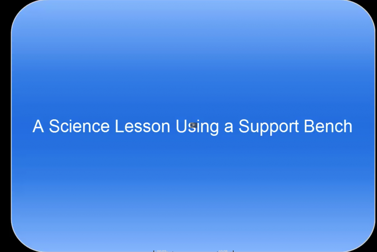 Click to view video of a boy with CVI using a support bench in a science lesson. Video of a science lesson using a support bench
