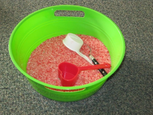 Simple sensory scooping with colored rice sensory rice