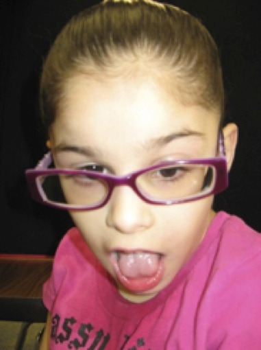 student with pink shirt and pink glasses