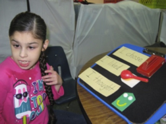 Student using symbols for literacy student using symbols for literacy