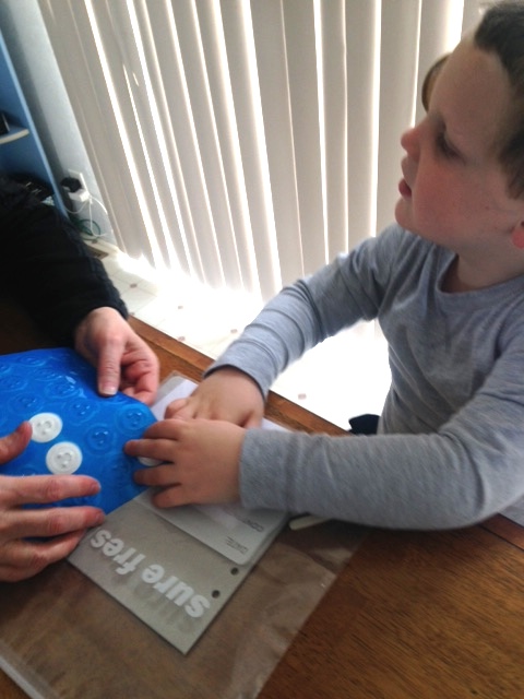 Adding tactile stickers Adding smiley stickers to invitations