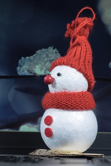 Craft Snowman made with foam balls, beads, two buttons, and fabric for hat and scarf