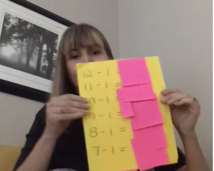 Removable sticky notes covering answer on a math worksheet Removable sticky notes covering answer on a math worksheet