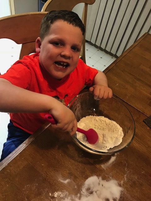 Stirring the dough with a spoon Stirring the dough with a spoon