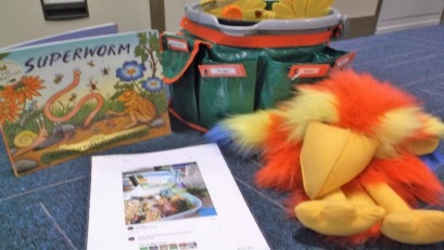 a bucket with items relating to the story about a super worm