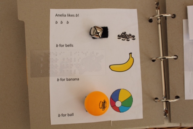 a page in a tactile book showing items that start with b, like banana, bell, and ball