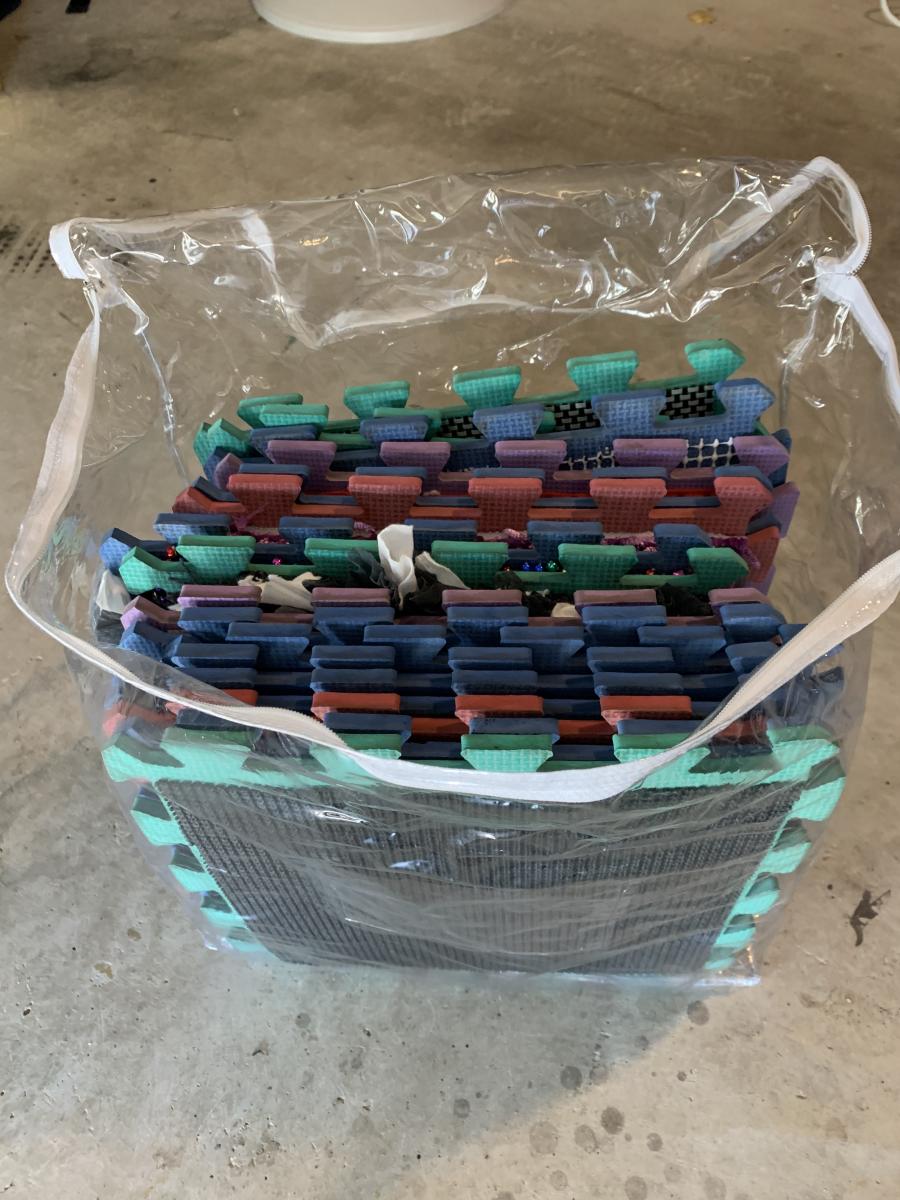 A bag of foam puzzle floor play mat pieces A bag of foam puzzle floor play mat pieces