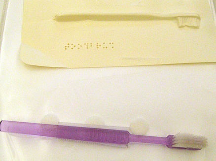 Tactile form of toothbrush paired with real toothbrush