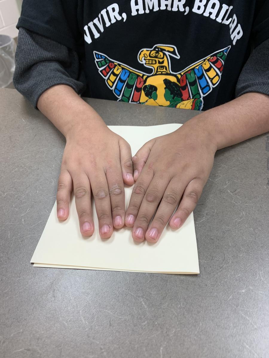 Folding the braille paper in half