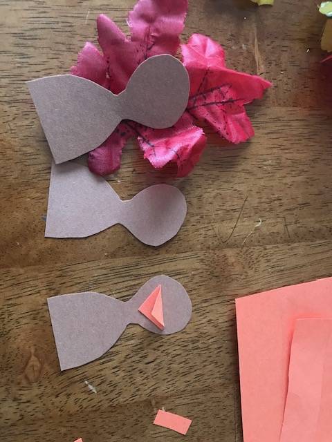 turkey shapes cut out of brown construction paper