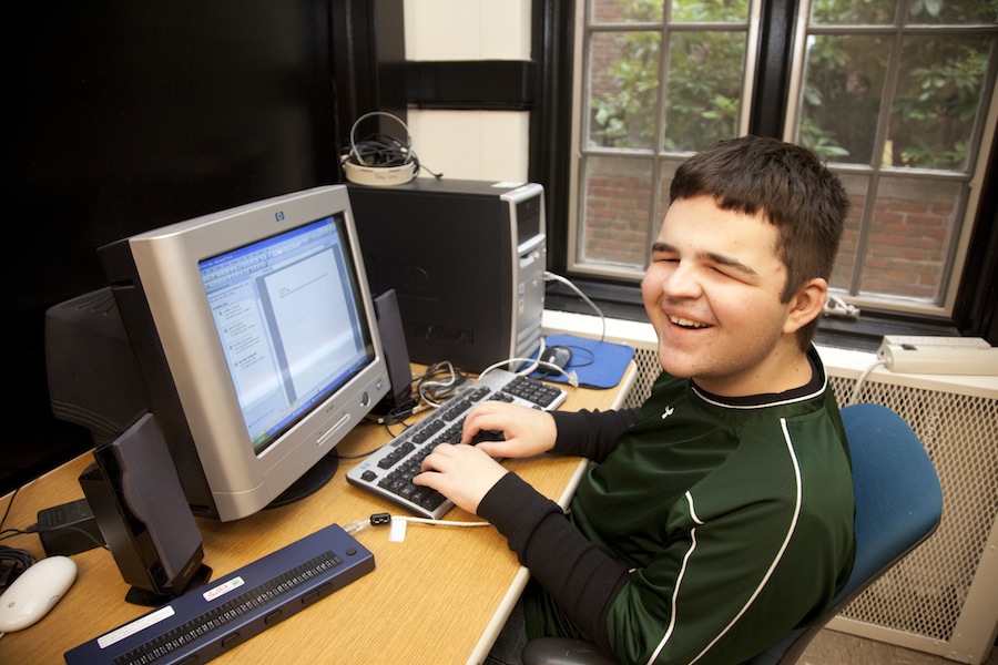A boy uses a computer