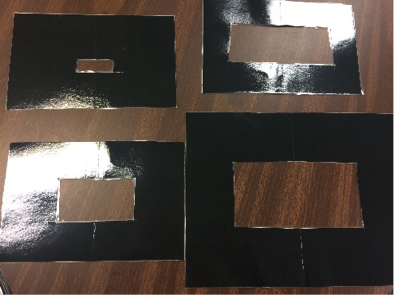 Beware of glare issues when using laminated materials. Windows cut out of cardstock