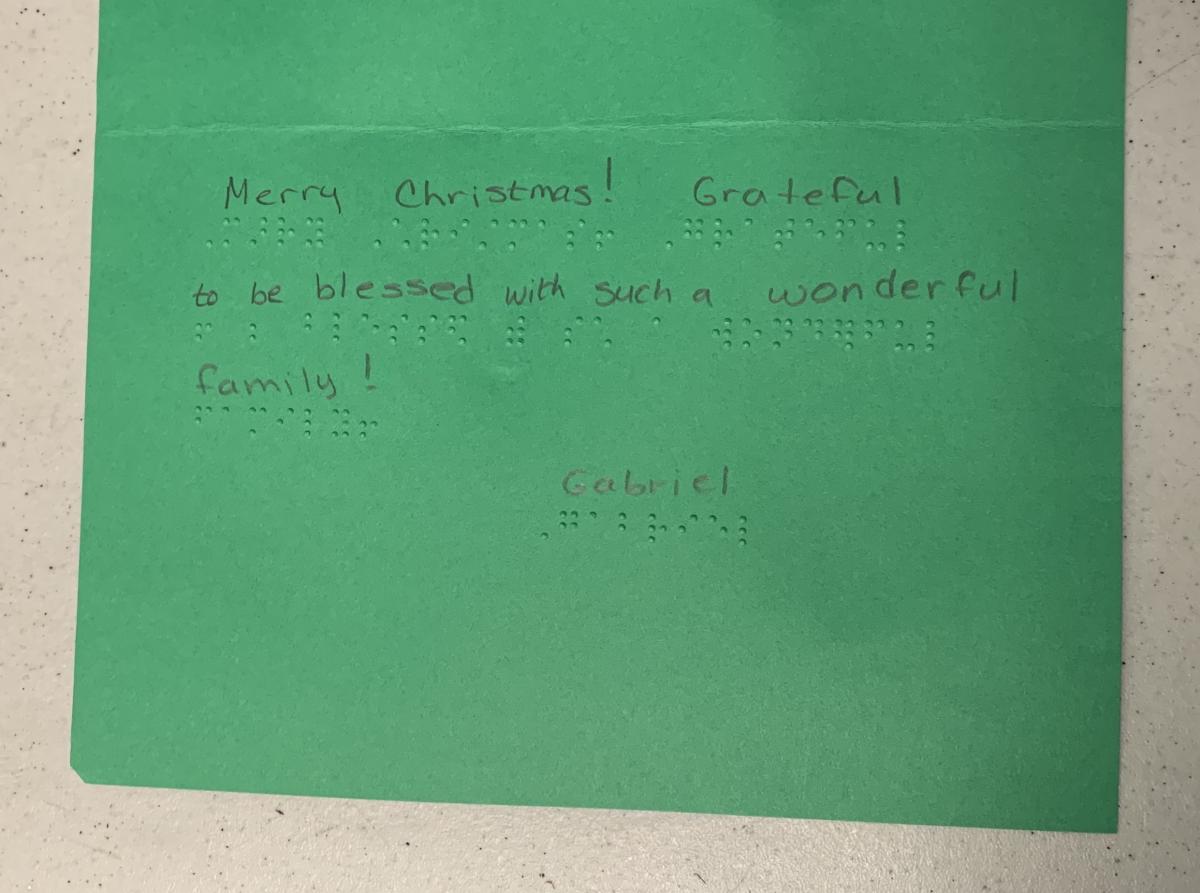 Christmas card with text in print and braille