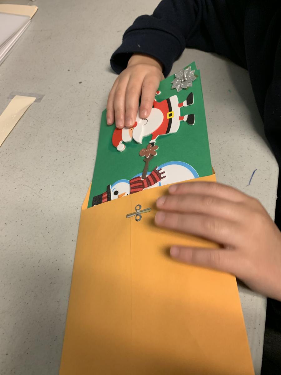 Placing the card in the envelope Placing the card in the envelope