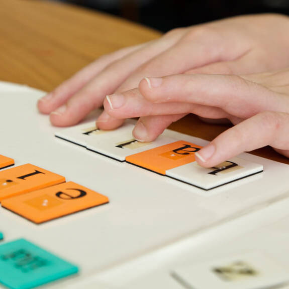 A student using Wilson Reading braille materials