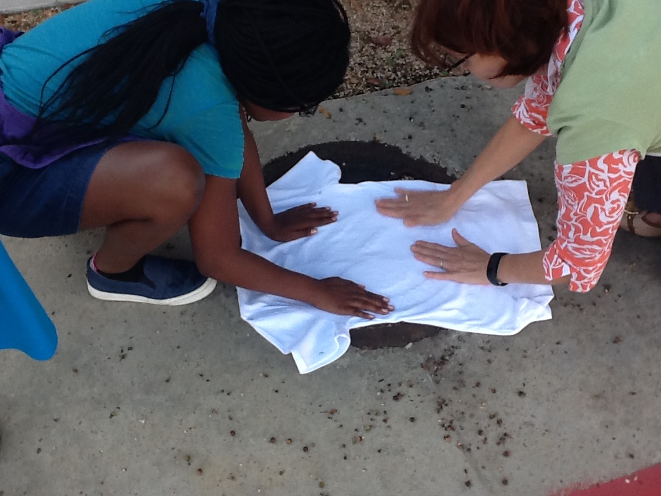 Working together on a product focused activity: silk screening T-shirts