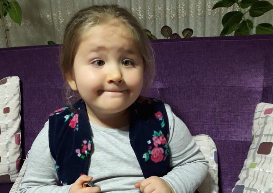 Young girl smiling at the camera