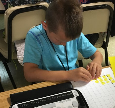 Boy reading bar graph Boy reading bar graph