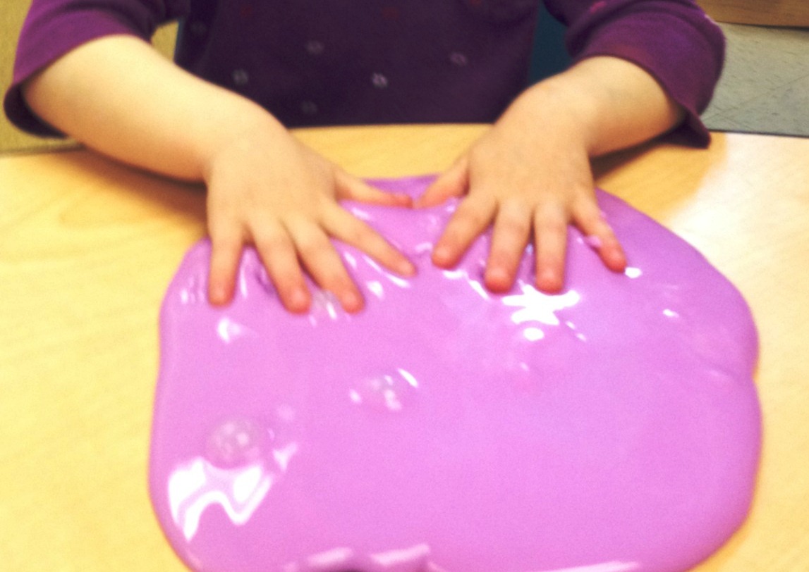 Young child demonstrates finger isolation with playdoh
