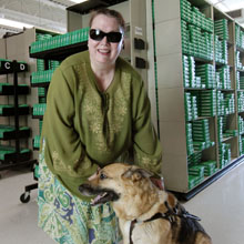 Kim Charlson with guide dog in Braille and Talking Book Library