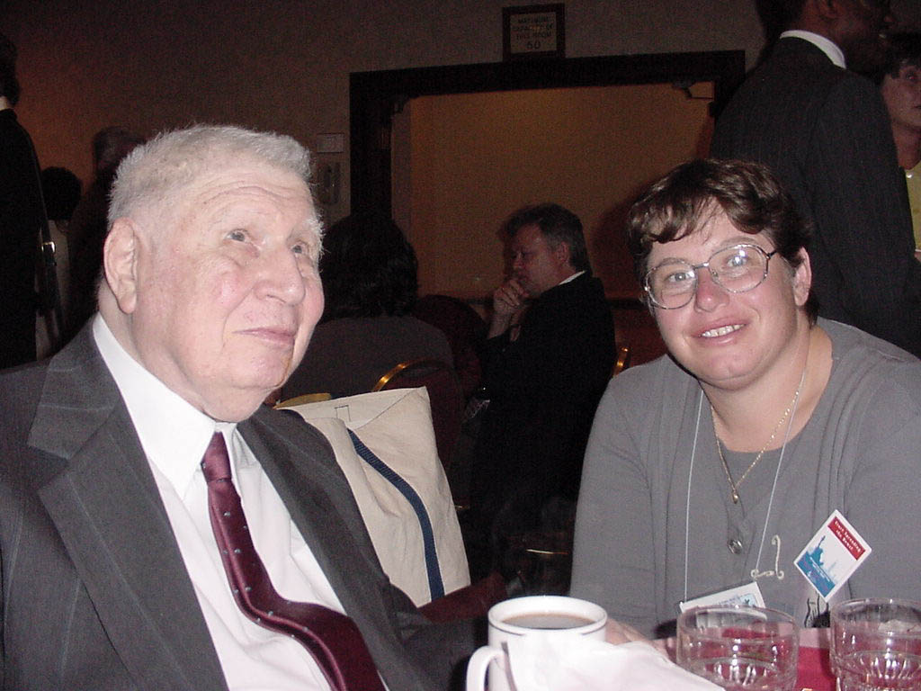 Dr. Abraham Nemeth and Dr. Rosenblum sitting together at a dinner table.