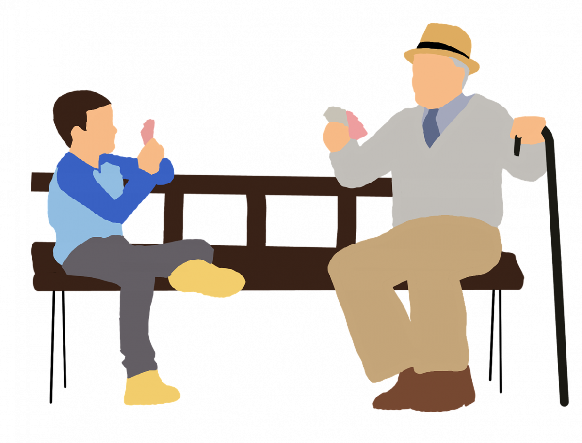 Child and old man sitting on a bench