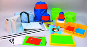 SAM kit that includes a guide book, trays, binders, object bags, 