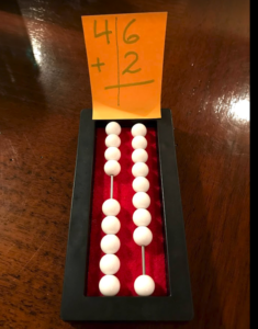 Beginners abacus with a ones and tens column showing the number 48.