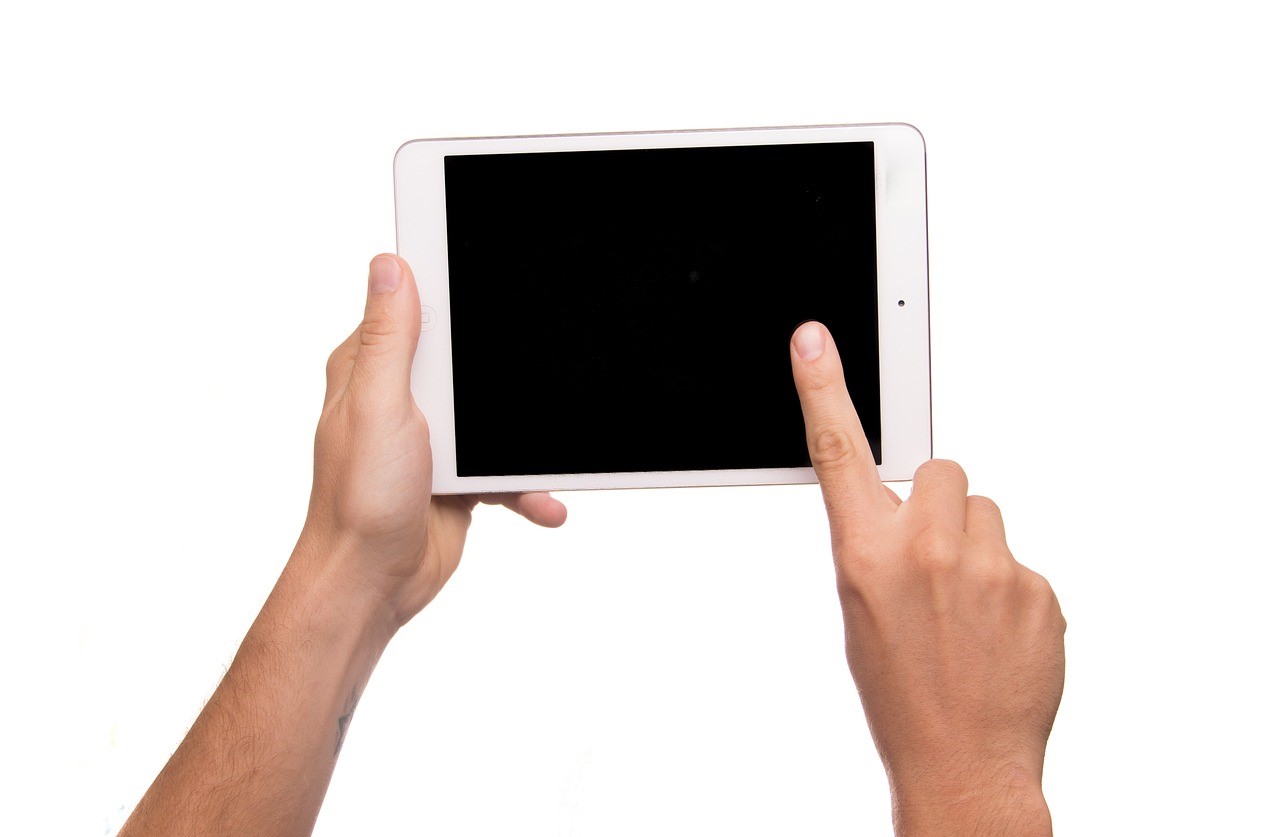iPad being held with 2 hands