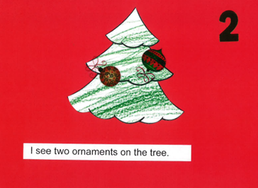 Christmas tree colored by student with the number 2 on the page and two ornaments on the tree. The sentence under it says, "I see tow ornaments on the tree."