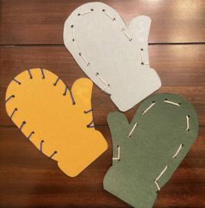 Three examples of the sewn mitten.