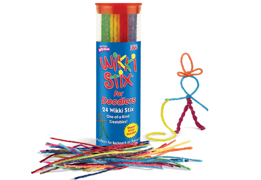 Wikki Stix container with some in front of it and a stick figure made from them on the side.