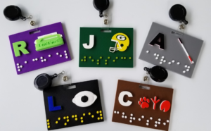 An array of varied tactile name badges. 