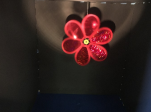 Mylar pinwheel in the shape of a flower inside the space.
