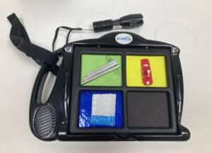 Communication device that has 3 tactile cards for travel targets that include the school store, the toy lending closet, and the mail room.