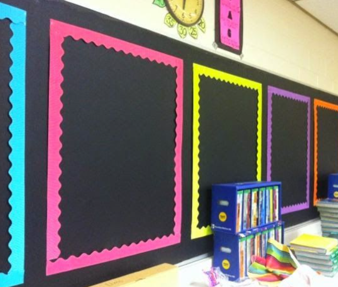 Black wall with 5 solid colored frames 