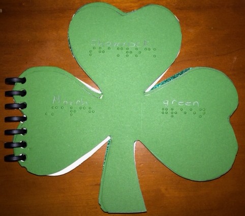 Shamrock book with print and braille vocabulary: March, shamrock, green