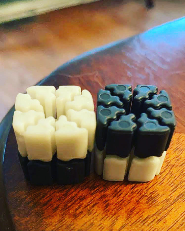 TI'TAINS product is pictured. Small plastic squares with spaces in them to hold cards.